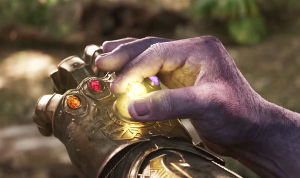Thanos adds the final Infinity Stone to the Infinity Gauntlet in the movie Avengers Endgame